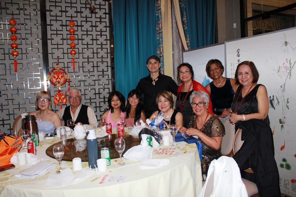 Large table gathering with festive background