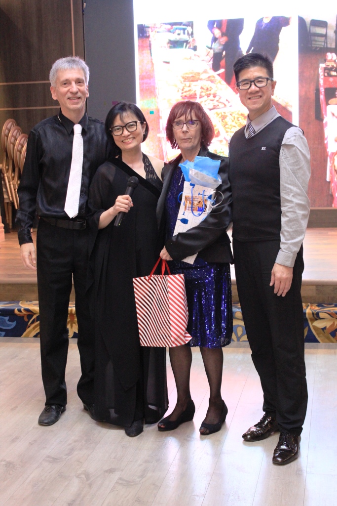 Hosts presenting gifts on stage